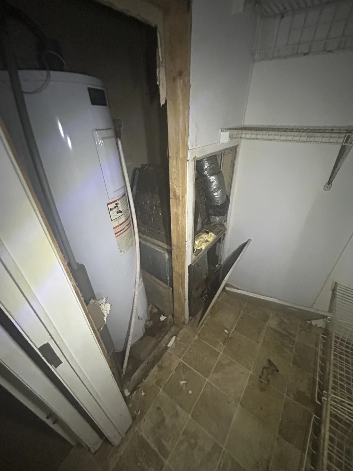 An appliance waiting for removal inside a property — ACG Junk & Debris