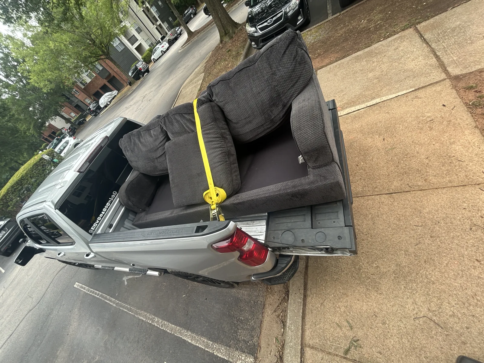 A real sofa pickup, secured for hauling by ACG
