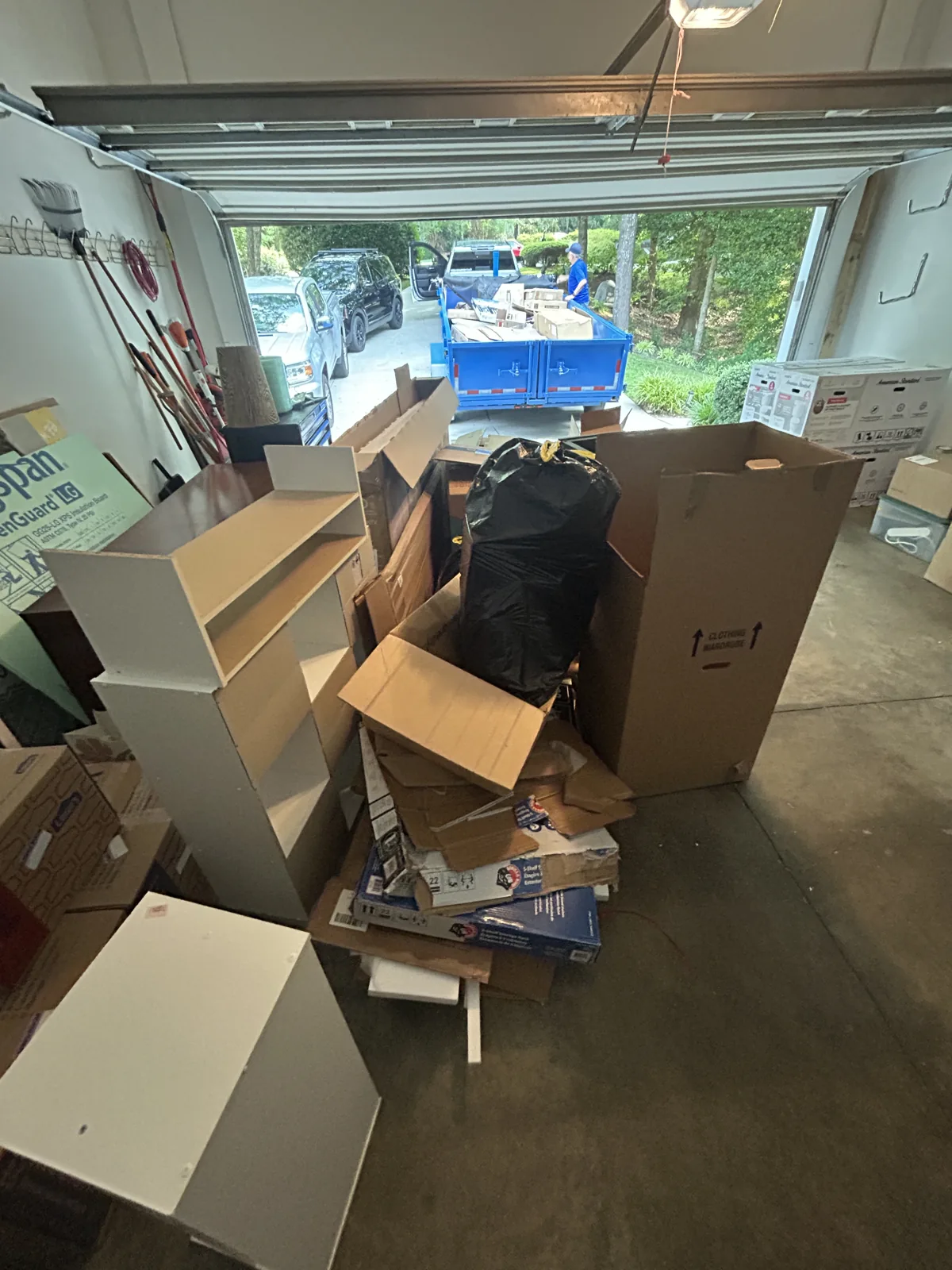 A real ACG garage cleanout with moving boxes and household junk ready to go