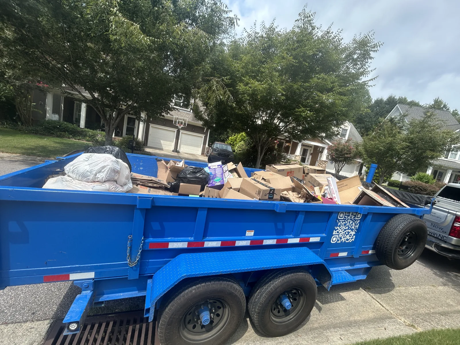 ACG’s blue dump trailer loaded for a real neighborhood pickup