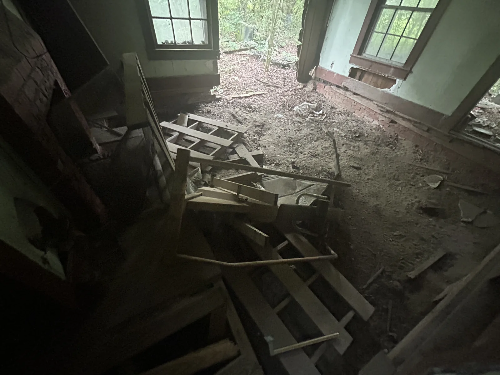 Leftover wood and materials in a property awaiting cleanup — ACG Junk & Debris