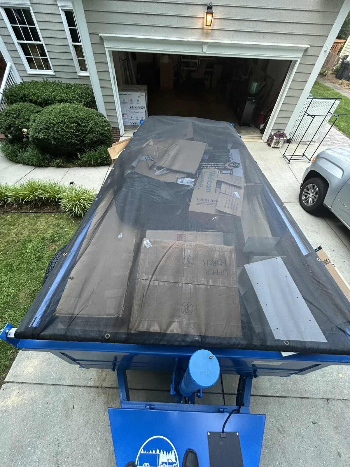 ACG’s blue dump trailer ready for a garage cleanout
